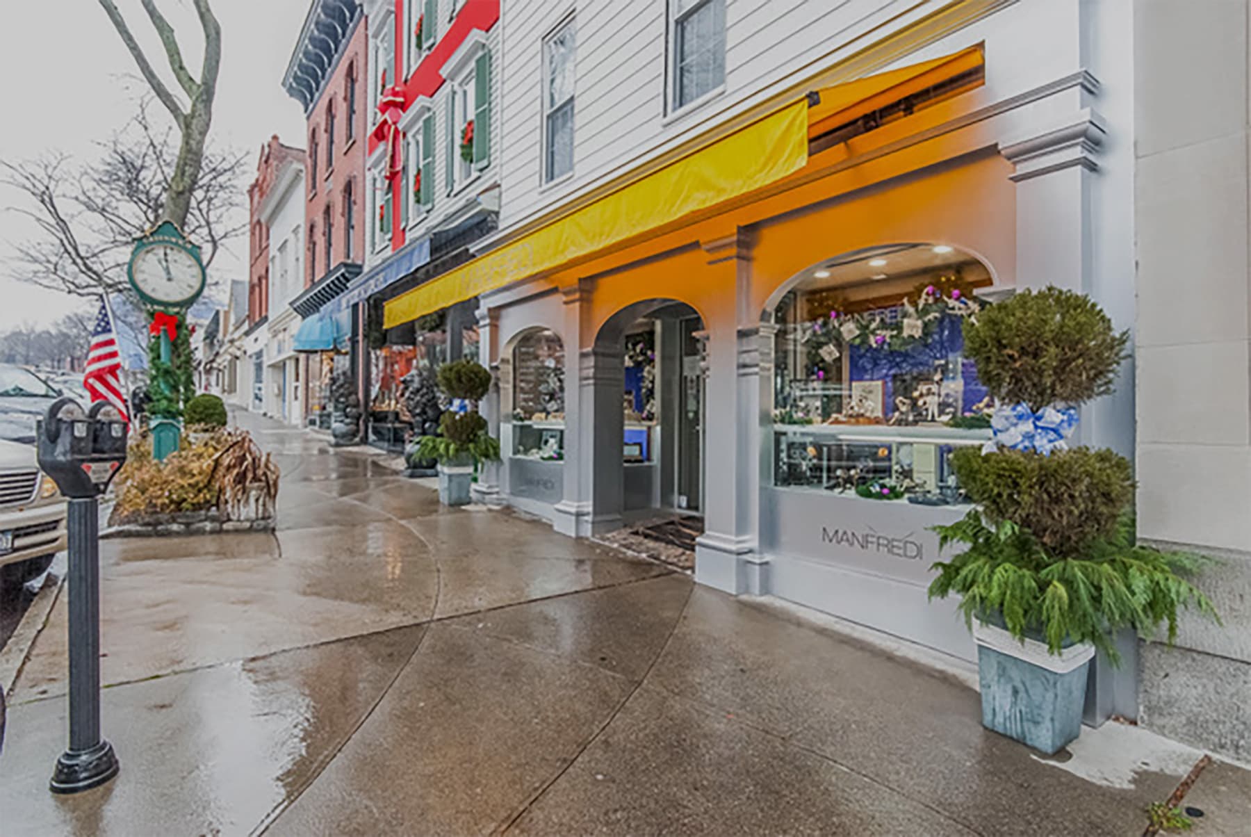 Greenwich, CT commercial streetscape with brick facades and a yellow awning